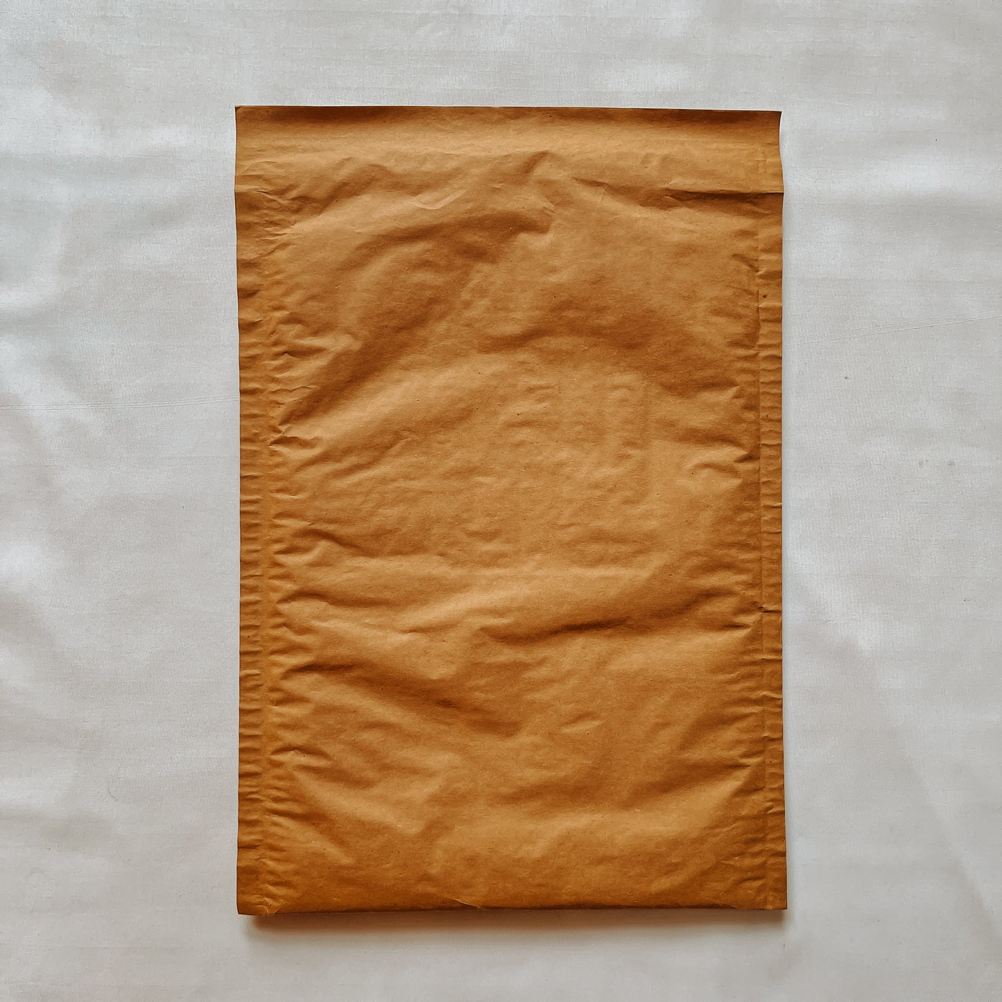 Front view of Jaivik Store EcoArmor shockproof paper mailer pack of 10, sustainable protective packaging