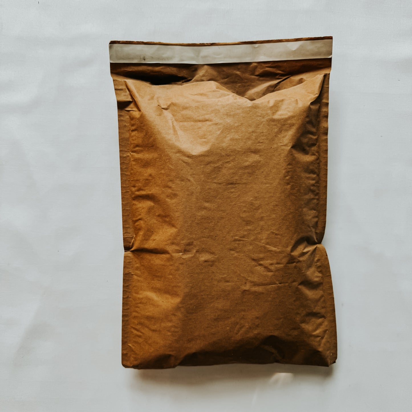 Jaivik Store EcoArmor shockproof paper mailer filled to capacity, demonstrating protective and sustainable packaging