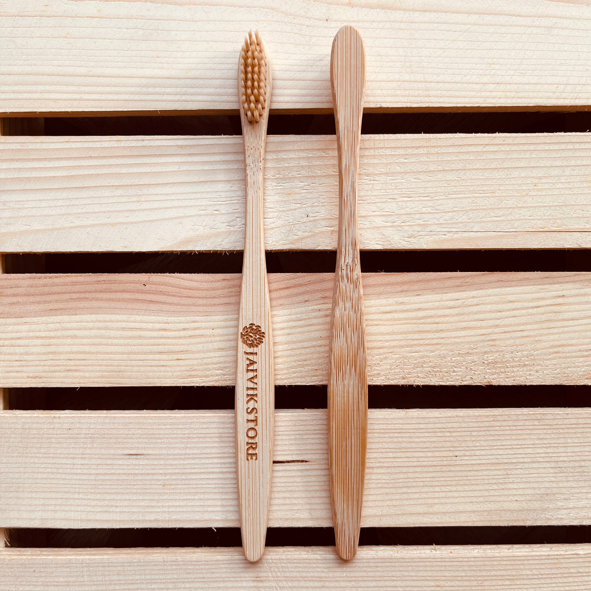 Front and back view of Jaivik Store Bamboo Toothbrush for Adults, Round Fibre Handle – BPA-free, soft charcoal bristles
