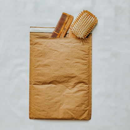 Jaivik Store EcoArmor shockproof paper mailer securely packed with a hairbrush and comb, eco-friendly packaging
